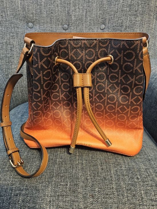 Calvin Klein Handbags - Calvin Klein Brown & Orange Gradient Monogram Drawstring Crossbody Bag